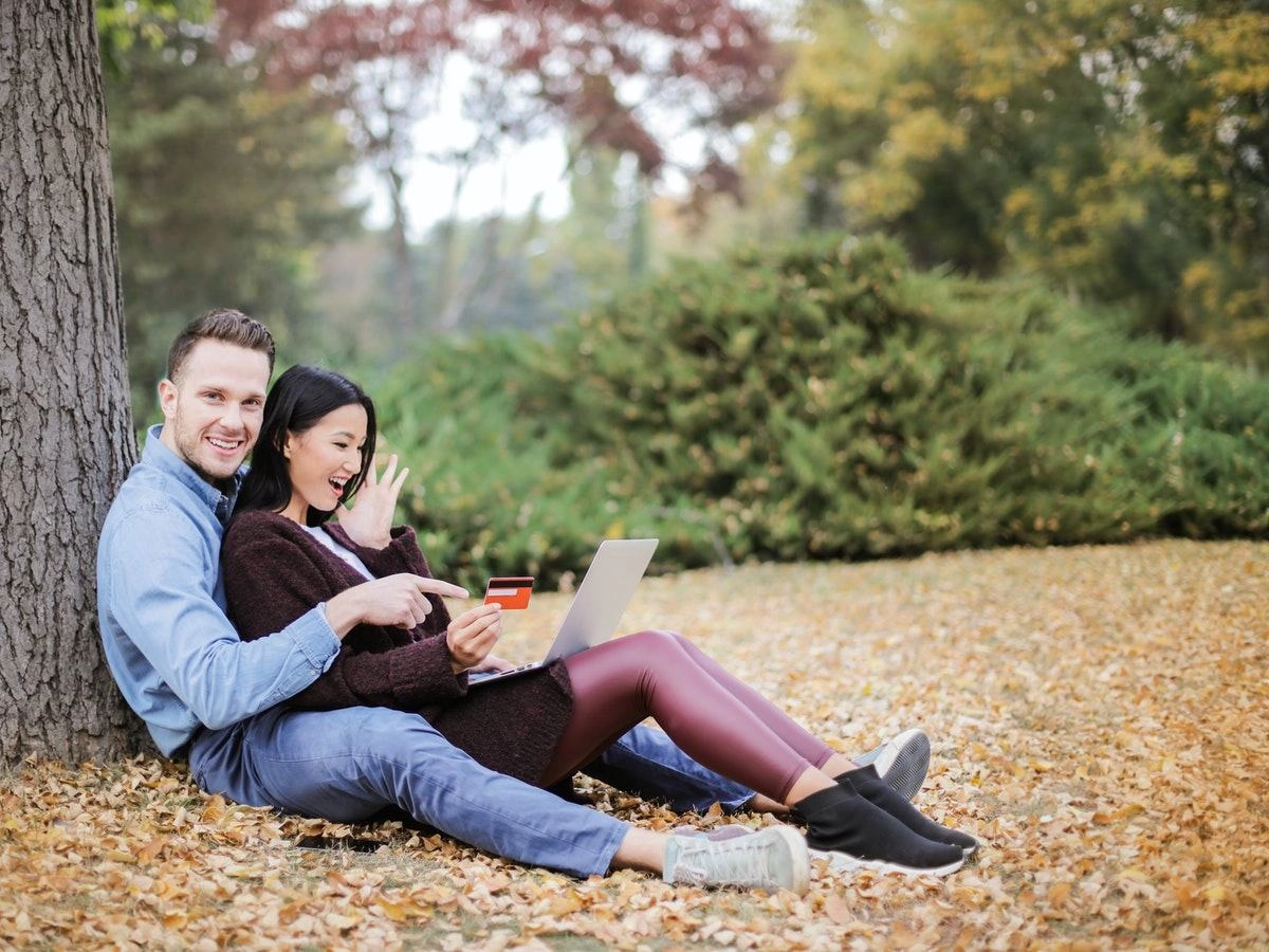 A loving and happy couple is enjoying the nature in a park